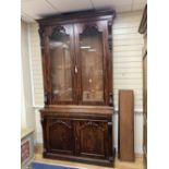 A Victorian mahogany library bookcase cupboard, width 135cm depth 49cm height 256cm