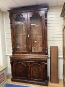 A Victorian mahogany library bookcase cupboard, width 135cm depth 49cm height 256cm