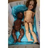 A Simon & Halbig bisque head jointed composition girl doll, H 22in and a jointed composition black