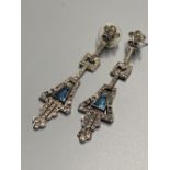 A pair of 1920's/1930's French white metal, white and blue paste set drop earrings, 61mm.