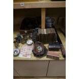 Assorted decorative objects including metalware, books, etc.