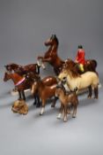 A collection of four various Beswick model horses including Highland, Another Bunch and Another