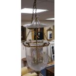 A pair of three light hall lanterns, cast with anthemions, height 63cm