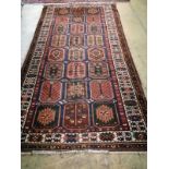 A Caucasian garden design rug, 310 x 160cmCONDITION: Possible old moth damage, wear to pile.