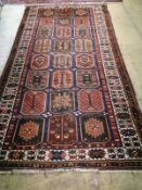 A Caucasian garden design rug, 310 x 160cmCONDITION: Possible old moth damage, wear to pile.