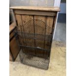 A 19th century pine wall cabinet, width 59cm depth 32cm height 84cm, together with a wirework rack