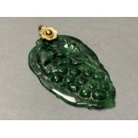 A yellow metal mounted mottled green jade 'leaf' pendant, overall 58mm, gross 11.1 grams.