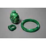 A Chinese green jadeite snuff bottle and stopper, a similar 'phoenix & dragon' bangle and an