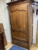 A French 18th century fruitwood single door armoire, width 120cm depth 70cm height 220cm