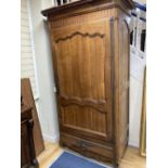 A French 18th century fruitwood single door armoire, width 120cm depth 70cm height 220cm