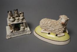 A humorous group of five cats having 'Five o'clock Tea' and a pottery sheep group, 9cm