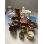 A collection of eleven lustre jugs and a mug, tallest 21cm