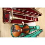 A violin, with 35.5cm back, with bow and some accessories, in case, together with Parrot trombone,