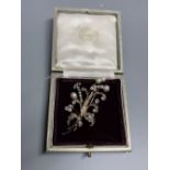 An early 20th century yellow and white metal, cultured pearl and diamond set floral spray brooch,
