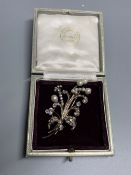 An early 20th century yellow and white metal, cultured pearl and diamond set floral spray brooch,