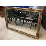 A modern gilt carved wood framed landscape wall mirror, width 116cm height 79cm