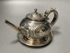 A George III Irish embossed silver bachelor's teapot, James Scott, Dublin, 1804, on an associated