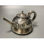 A George III Irish embossed silver bachelor's teapot, James Scott, Dublin, 1804, on an associated