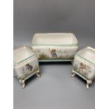 A set of three 19th century French porcelain jardinieres, painted with classical children playing,