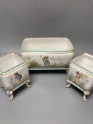 A set of three 19th century French porcelain jardinieres, painted with classical children playing,