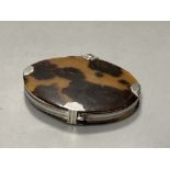 A Georgian tortoiseshell and white metal mounted oval magnifying glass, 86mm(a.f.).CONDITION: Both
