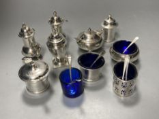 A George V silver three piece condiment set, London, 1923, a pair of silver pepperettes & four other