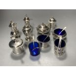 A George V silver three piece condiment set, London, 1923, a pair of silver pepperettes & four other