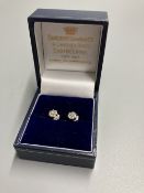 A pair of modern white metal (stamped 750) and small seven stone diamond cluster ear studs, 5mm,