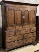 A George III oak housekeeper's cupboard, width 138cm depth 52cm height 174cm