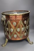 A Victorian copper and brass cylindrical coal box, with lion-mask ring handles, wood liner, 38cm