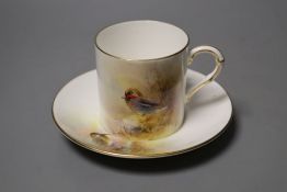 A Royal Worcester coffee can and saucer painted with game birds by P. Platts, signed, date code