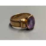 A 1950's? 585 yellow metal and amethyst set dress ring, size K, gross 7.3 grams.CONDITION: Minor