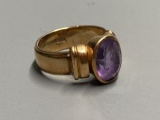 A 1950's? 585 yellow metal and amethyst set dress ring, size K, gross 7.3 grams.CONDITION: Minor