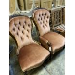 A pair of Victorian walnut spoon back button back chairs (one with arms)