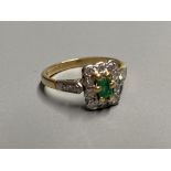 A modern 18ct gold, emerald and diamond rectangular cluster ring, with diamond set shoulders, size