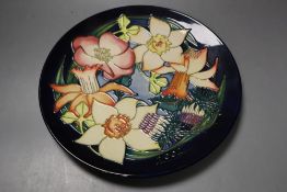 A Moorcroft Elizabeth II Golden jubilee 2002 plate, tube lined with flowers of the British Isles,