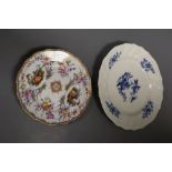 An 18th century Tournay or Arras moulded plate and a 19th century Meissen plate painted with two