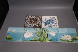 A set of four Victorian coloured tiles, 15cm and two other tiles