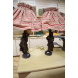 A pair of patinated spelter figural table lamps, male and female water carriers, 57cm excluding