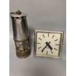 A 1930's Gent's of Leicester mantel clock and a Miner's lamp by Eccles, 24cm