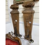 A pair of oak and iron wall sconces, height 88cm