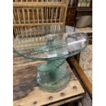 A contemporary circular glass occasional table, diameter 60cm height 50cm