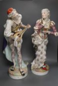 A pair of large 19th century Paris porcelain figures of a mandolin player and a woman dancer,