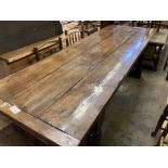 An 18th century style oak refectory dining table, 240 x 83cm height 76cm