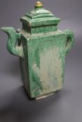 A Chinese green glazed square tea or wine pot, Ming dynasty, 18cm high