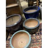 Four glazed earthenware garden planters, largest diameter 37cm