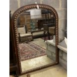 A Victorian style arched overmantel mirror, width 106cm height 150cm.