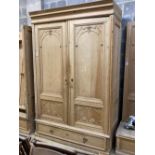 A 19th century French pine two door 'knockdown wardrobe' with drawer and base, width 152cm depth