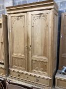 A 19th century French pine two door 'knockdown wardrobe' with drawer and base, width 152cm depth