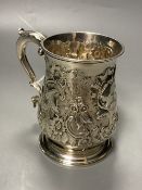 An early George III silver mug, with engraved crest and later embossed decoration, William Shaw